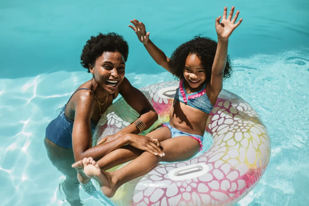 in a pool is a woman and child Wild Air Landing apartments in zionsville